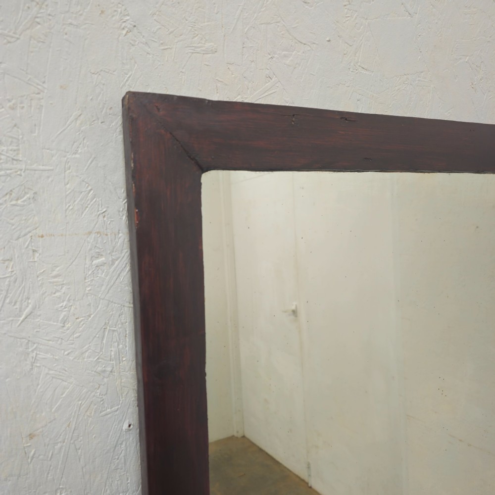 A large 19th-century rectangular full-length mirror with a dark-stained pine frame. View VI