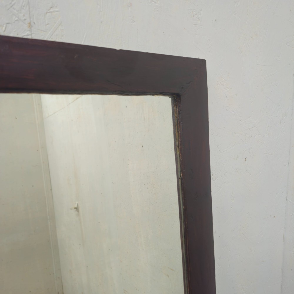 A large 19th-century rectangular full-length mirror with a dark-stained pine frame. View VII