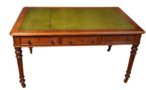 A leather topped writing table by Druce and Co London. 