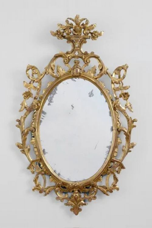 A FINE GEORGE 111 OVAL GILTWOOD CARVED MIRROR