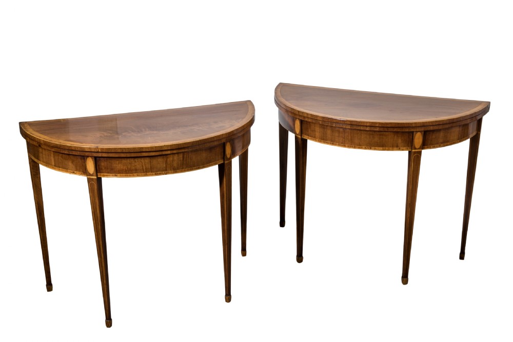 Pair of George III mahogany demi-lune card tables. Circa 1790