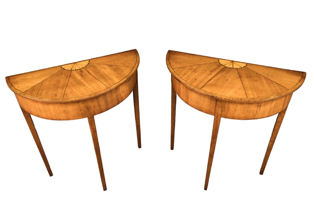 Small pair of George III mahogany demi-lune consult tables. Circa 1790
