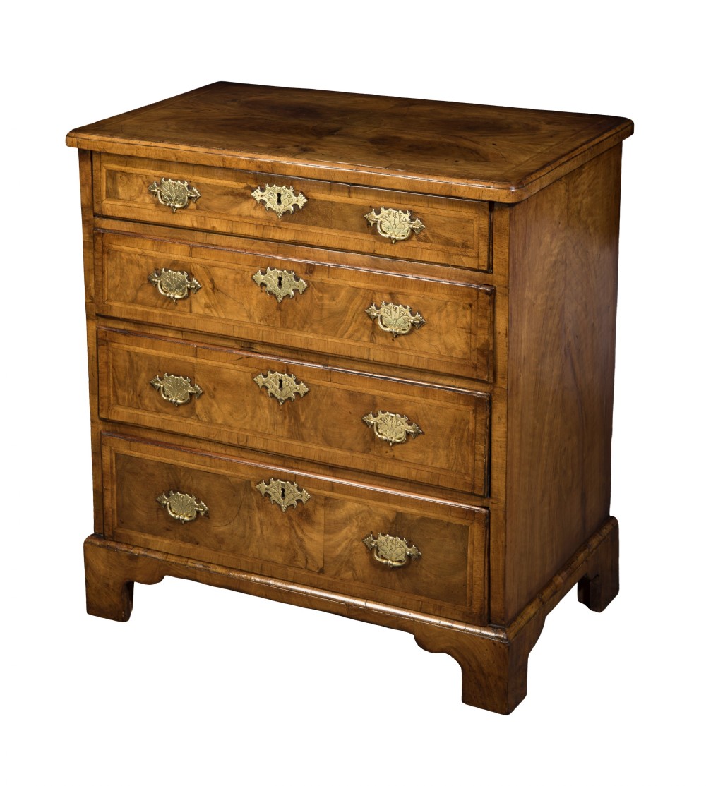 A very fine small George I walnut chest. Circa 1710