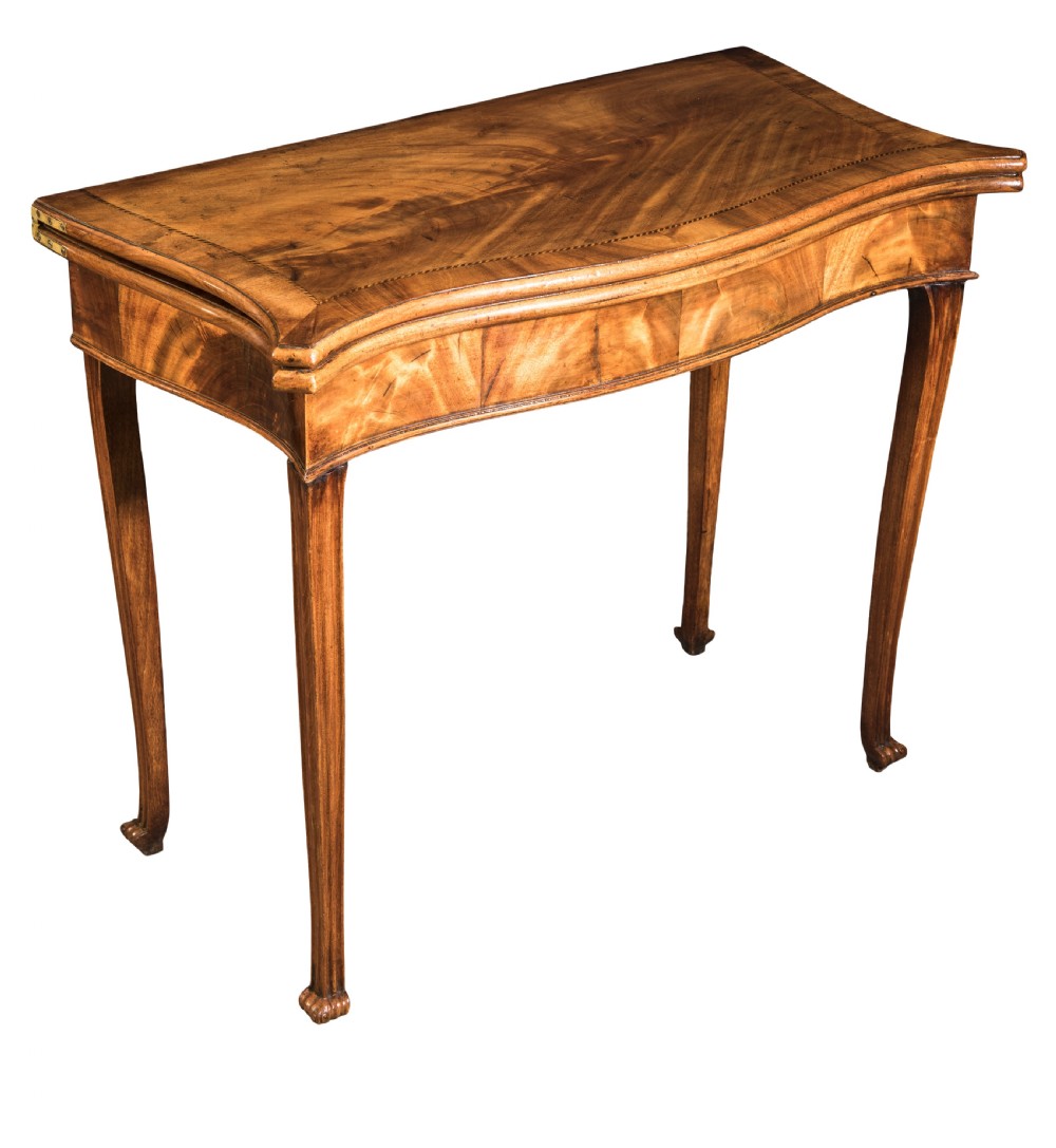 A well-figured George III mahogany Serpentine tea table Circa 1770