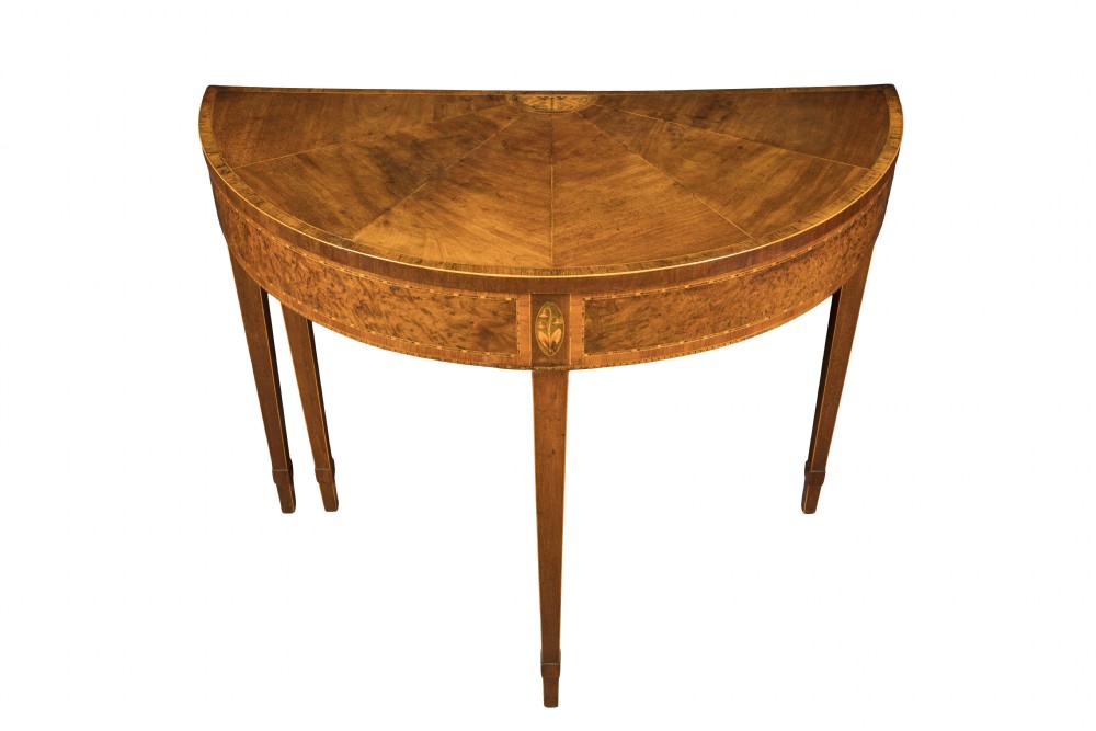 A pair of late eighteenth-century George III mahogany demi-lune card tables featuring fan-shaped veneered tops, inlaid friezes, and square tapered legs. View III