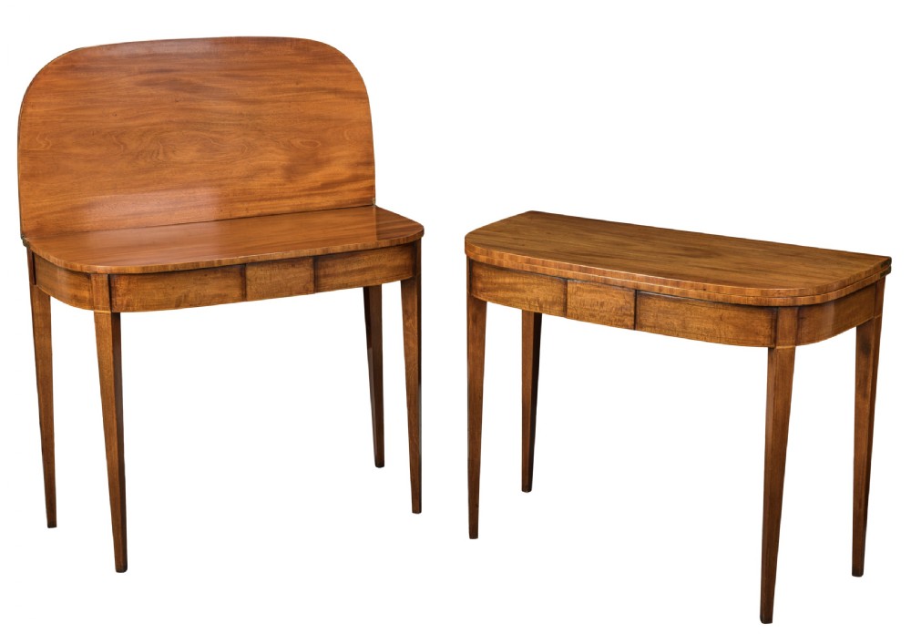 Pair of George III mahogany D-shaped tea tables. Circa 1800 View II