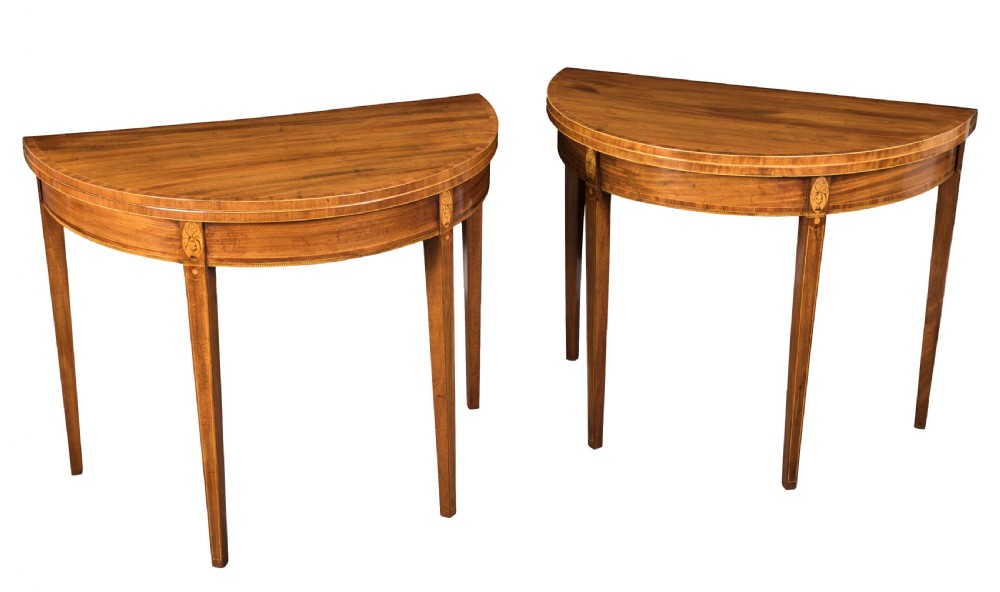 Pair of George III mahogany demi-lune card tables. Circa 1790