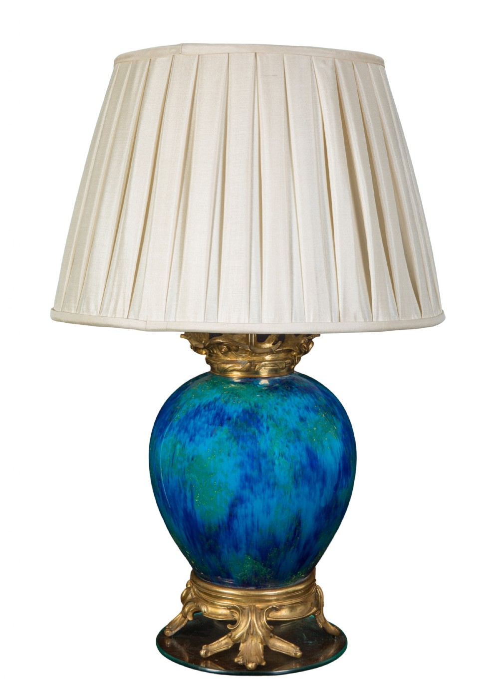 A nineteenth-century French ceramic vase lamp featuring a mottled turquoise glazed body, gilt-bronze mounts, and a pleated cream fabric shade.