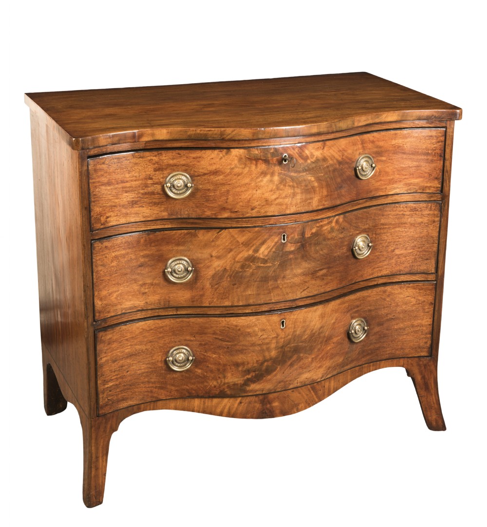 A George III mahogany serpentine chest featuring three drawers with brass ring handles and splayed bracket feet.
