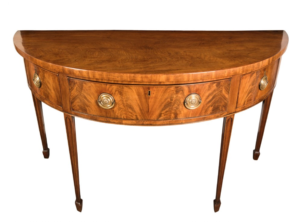 George III mahogany semi-elliptical side table. Circa 1790