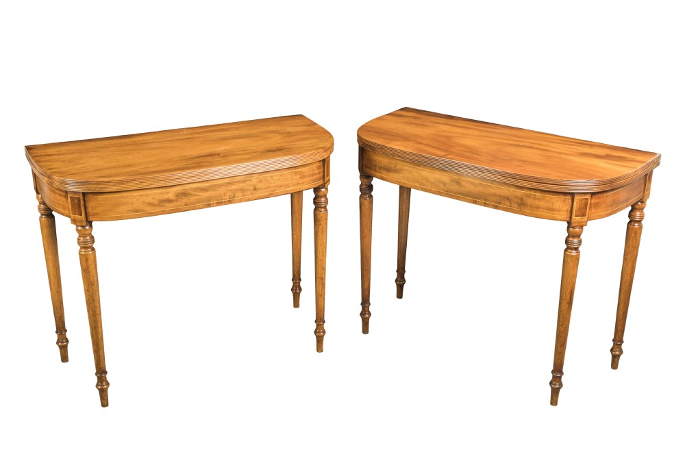 Pair of George III mahogany D-shaped tea tables. Circa 1810
