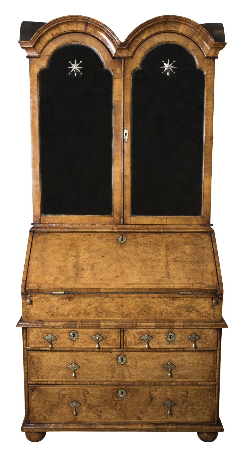 An antique George I walnut bureau bookcase featuring an open double-domed upper cabinet, an angled fall-front desk with leather writing slope, interior pigeonholes, and lower chest drawers with brass handles. View III