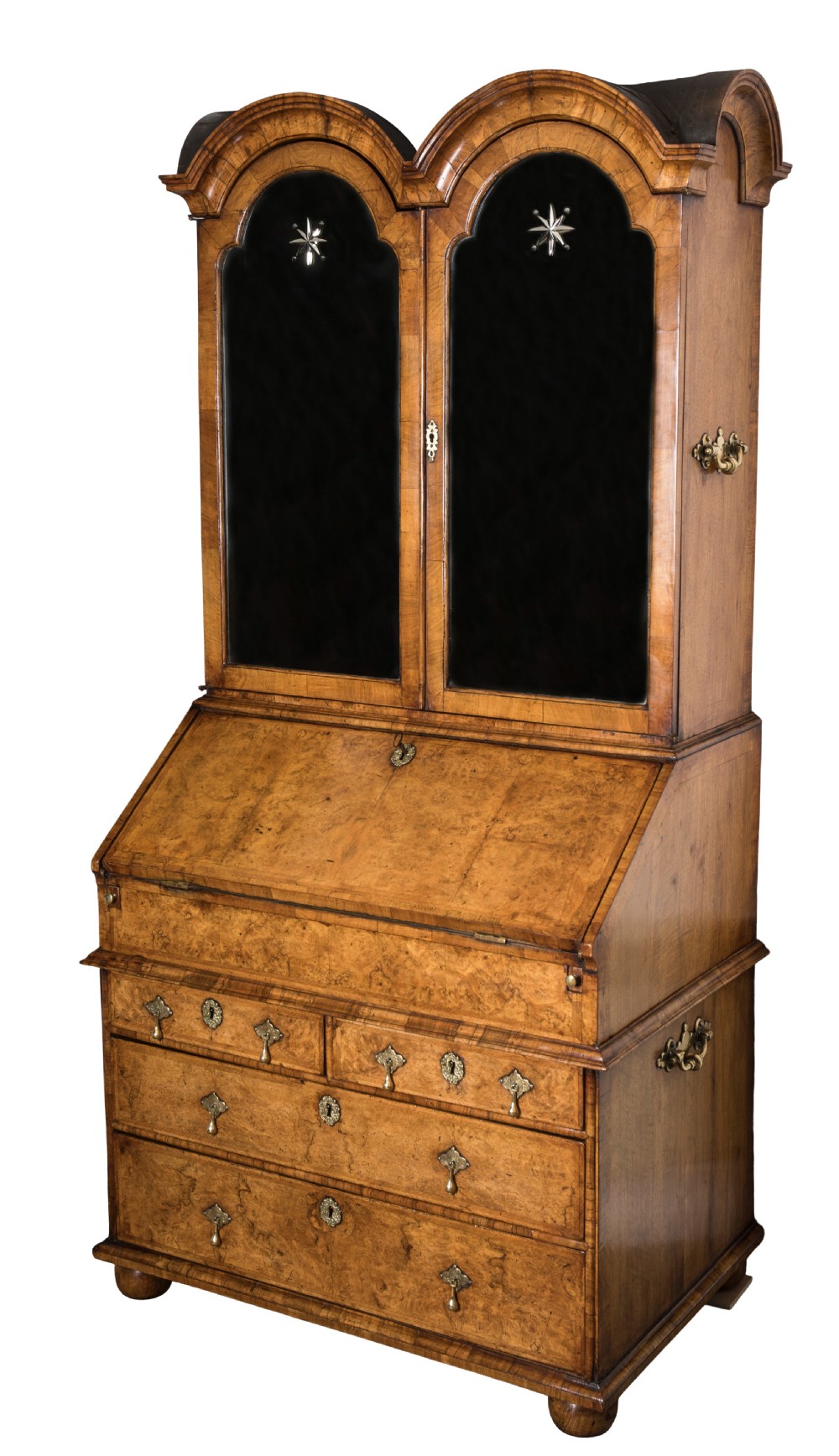 An antique George I walnut bureau bookcase featuring an open double-domed upper cabinet, an angled fall-front desk with leather writing slope, interior pigeonholes, and lower chest drawers with brass handles. View IV