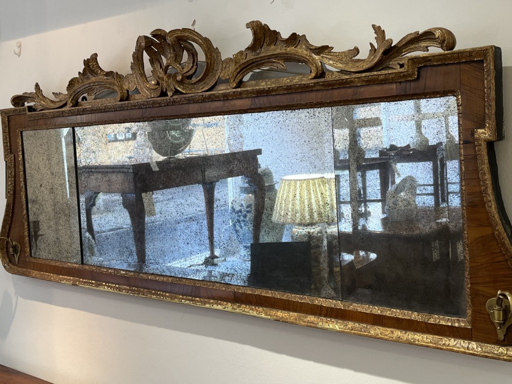 George II walnut and parcel gilt over mantel mirror, Circa 1730