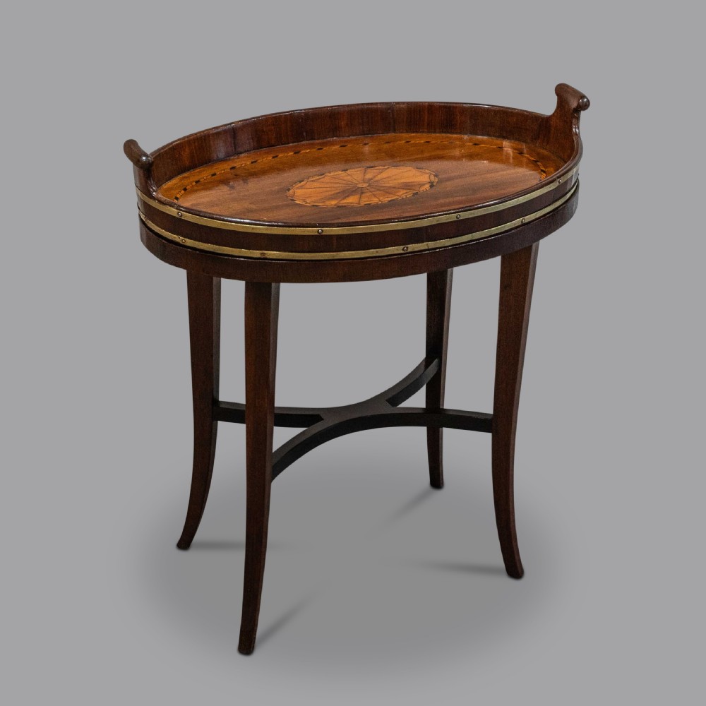 A small George III Mahogany brass bound inlaid tray on late stand 