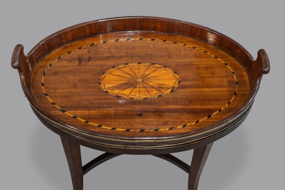 A small George III Mahogany brass bound inlaid tray on late stand  View II