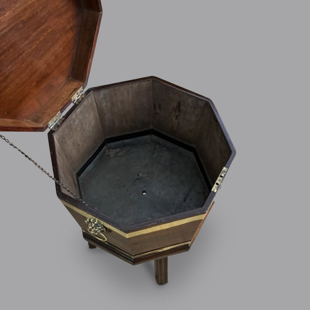An 18th-century octagonal mahogany wine cooler featuring polished brass binding, a hinged lid with keyhole, and square moulded legs. View III