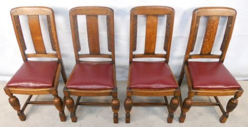 Set of Four Oak Dining Chairs with Carved Backs