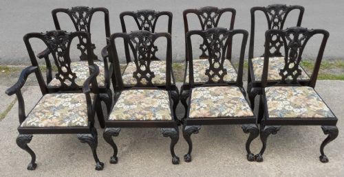 fig 1. A set of eight dark mahogany Chippendale style dining chairs with carved pierced splats, upholstered drop-in seats, and cabriole legs with ball and claw feet.