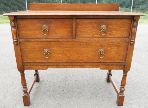 Oak Chest of Drawers by Waring & Gillow