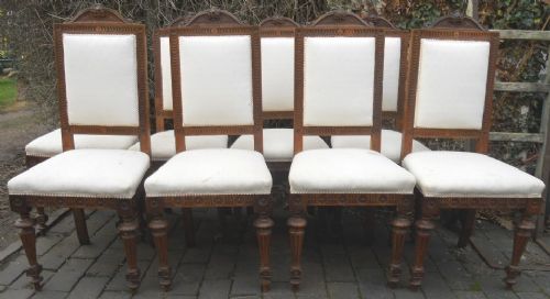 Set of Eight Carved Walnut Upholstered Highback Dining Chairs