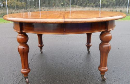 VICTORIAN MAHOGANY OVAL EXTENDING THREE LEAF DINING TABLE TO SEAT TWELVE - ADDITIONAL PHOTO 1