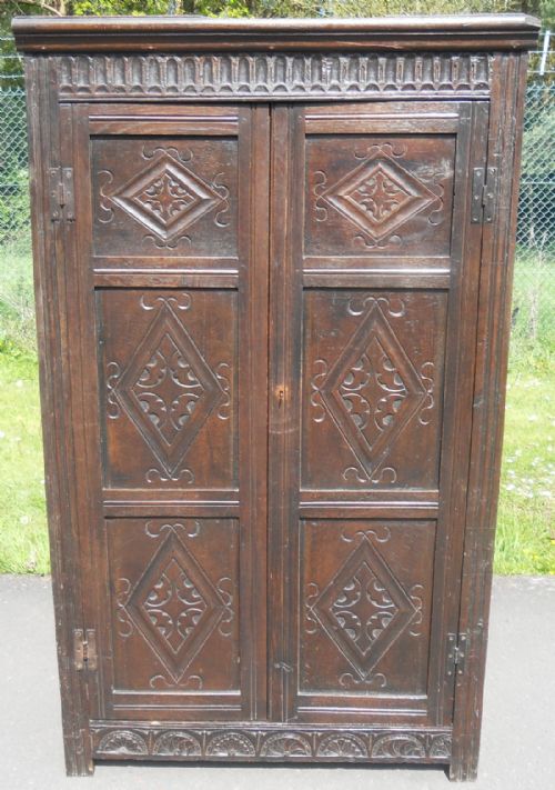 Antique Carved Dark Oak Panelled Narrow Cupboard