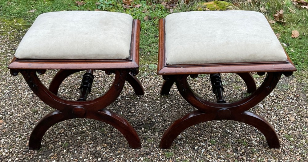 A pair of William IV mahogany x-frame stools with neutral light beige upholstered padded tops and turned central stretchers. View II
