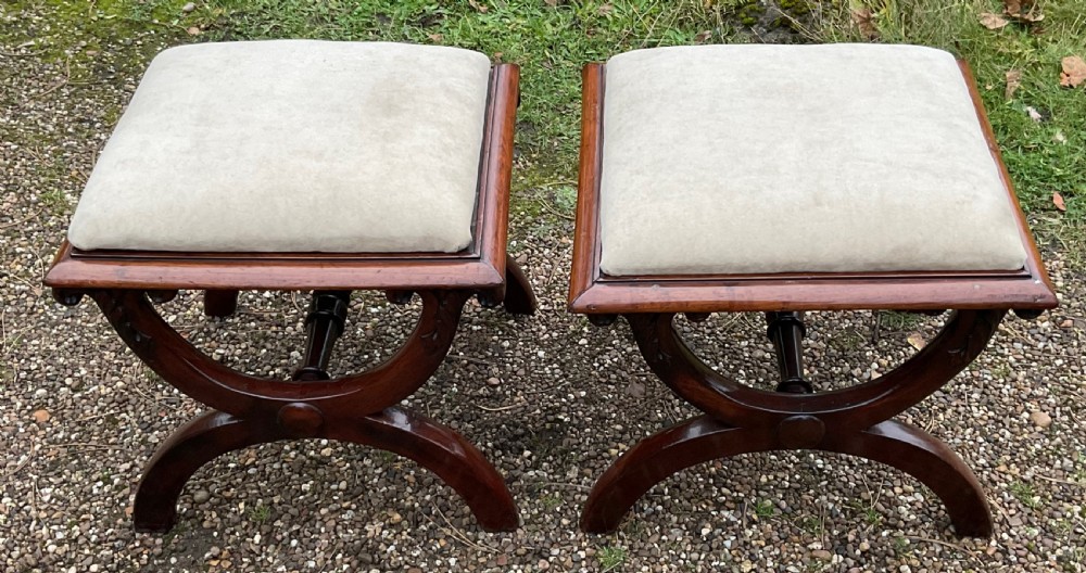 A pair of William IV mahogany x-frame stools with neutral light beige upholstered padded tops and turned central stretchers. View III