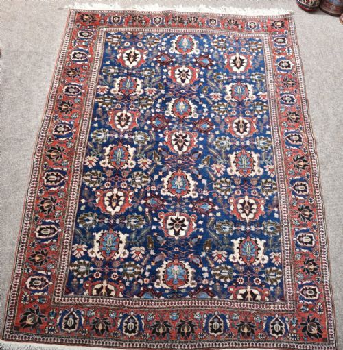 OLD PERSIAN VERAMIN RUG WITH MID BLUE GROUND