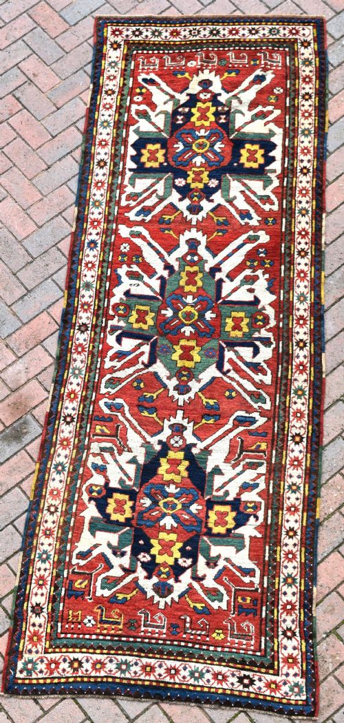 an antique chelebered eagle kazak long rug 285x102cm - CATEGORY: ANTIQUE RUGS - DATED 1880