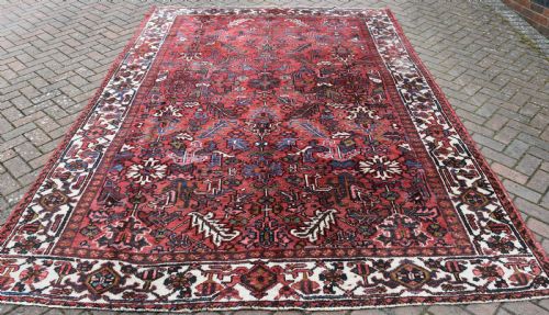 an old persian heriz carpet with allover design 326x223cm - CATEGORY: ANTIQUE RUGS - DATED 1930