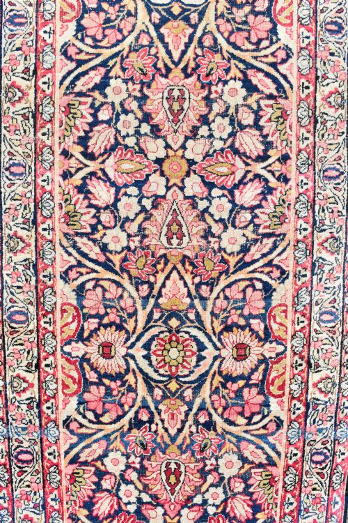 AN ANTIQUE KIRMAN RUNNER OF EXCEPTIONALLY LONG NARROW PROPORTIONS - ADDITIONAL PHOTO 2