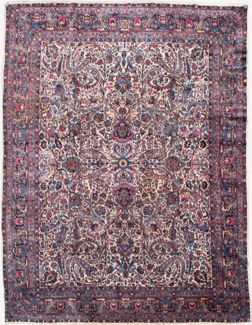 A LARGE KIRMAN CARPET 473X350CM