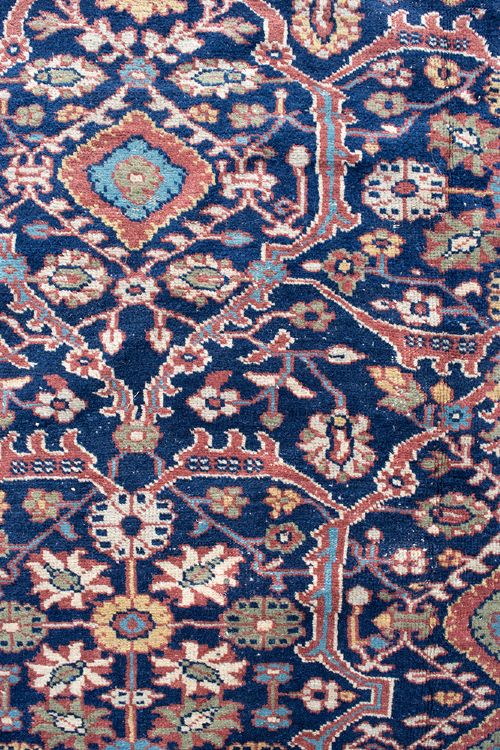 A large hand-knotted antique Persian Mahal carpet featuring intricate floral palmette patterns in navy, terracotta, and soft green across a dark blue field. View II