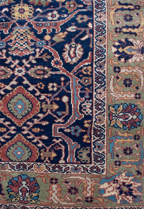 A large hand-knotted antique Persian Mahal carpet featuring intricate floral palmette patterns in navy, terracotta, and soft green across a dark blue field. View III
