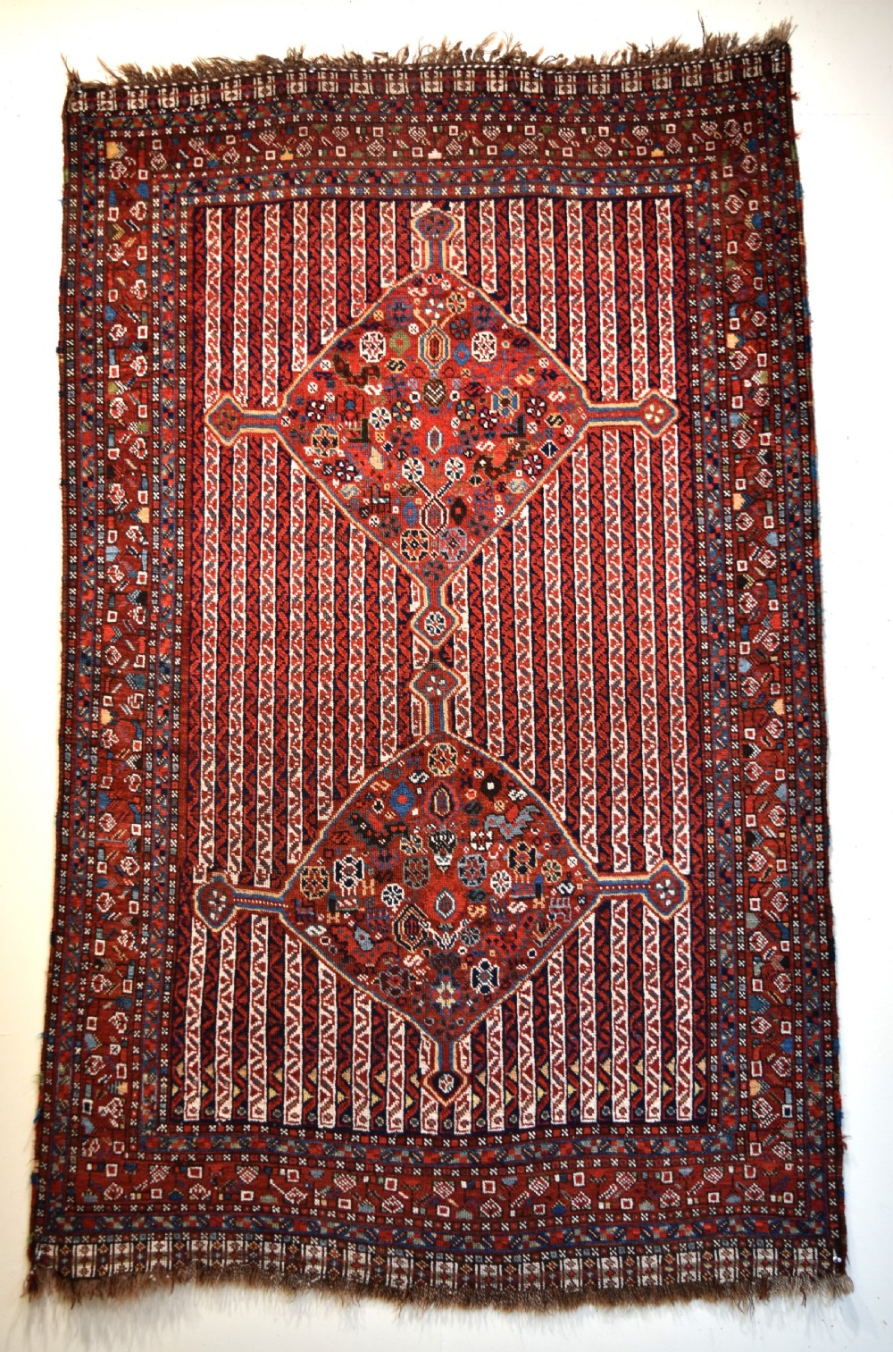 An antique South West Persian Khamseh tribal rug