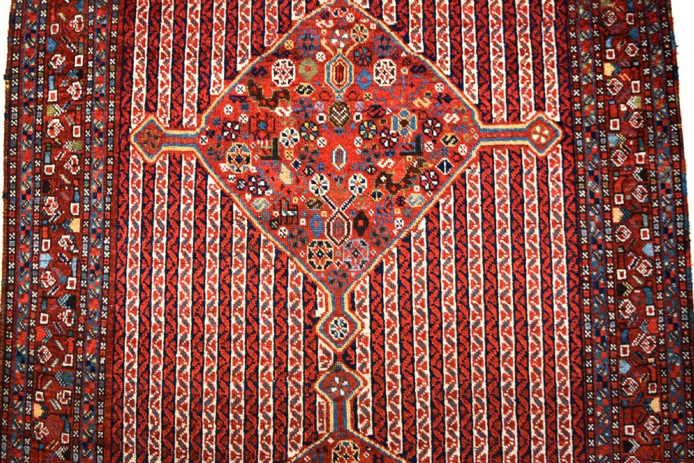 An antique South West Persian Khamseh tribal rug View III