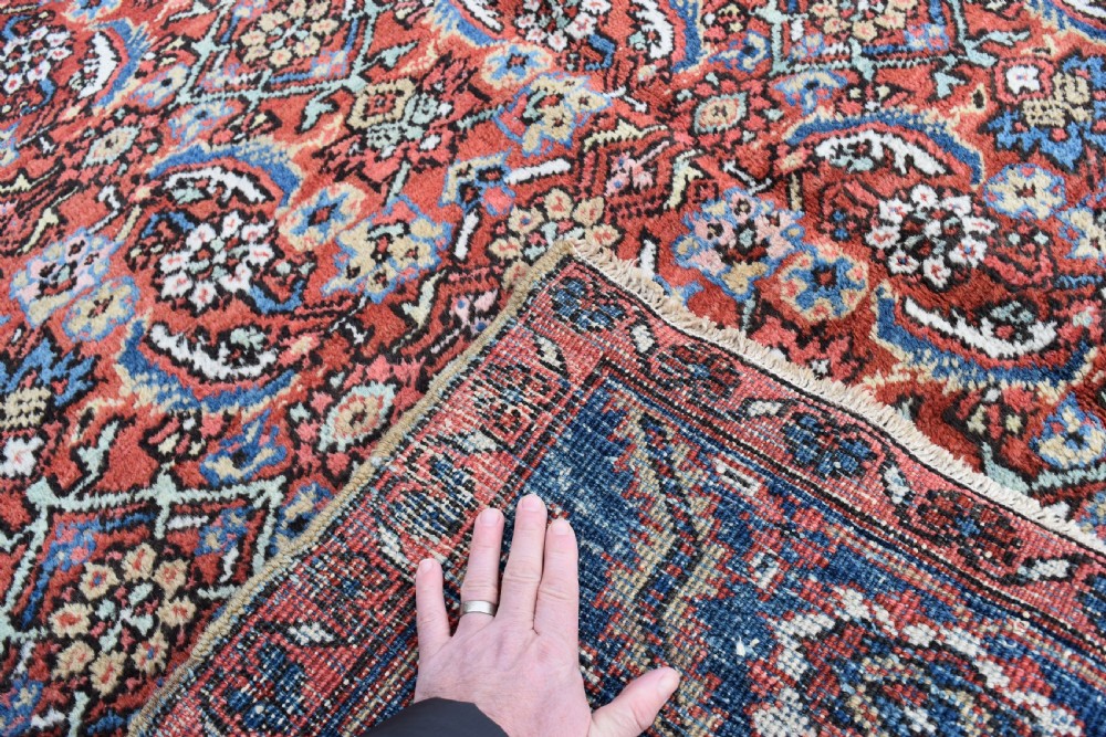 An antique Persian Heriz carpet 385x314cm View III