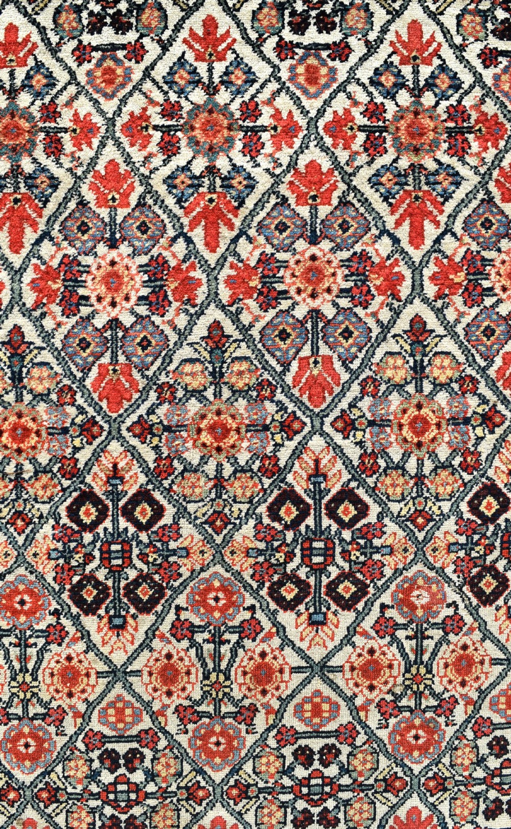 An antique long North West Persian Kelleh carpet featuring an intricate repeating lattice geometric motif in terracotta, navy blue, and cream tones. View IX