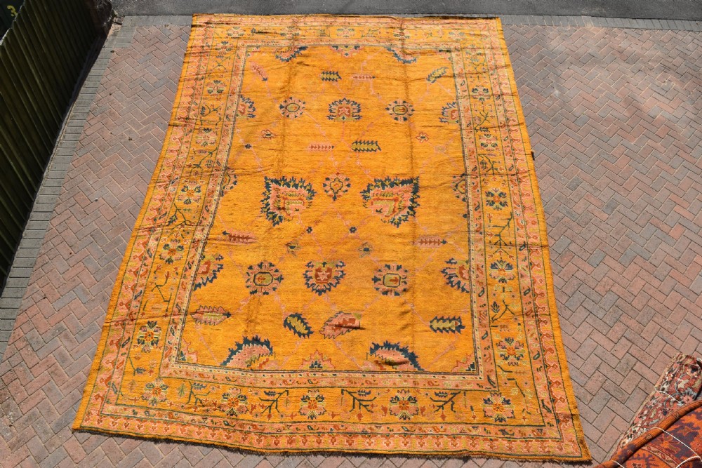 A very large antique Ushak carpet 505x394cm