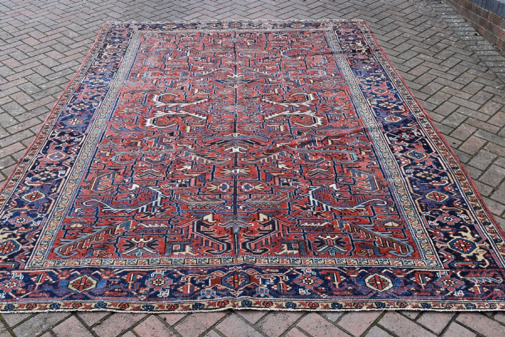 An Old Persian roomsize Heriz carpet 307x221 cm
