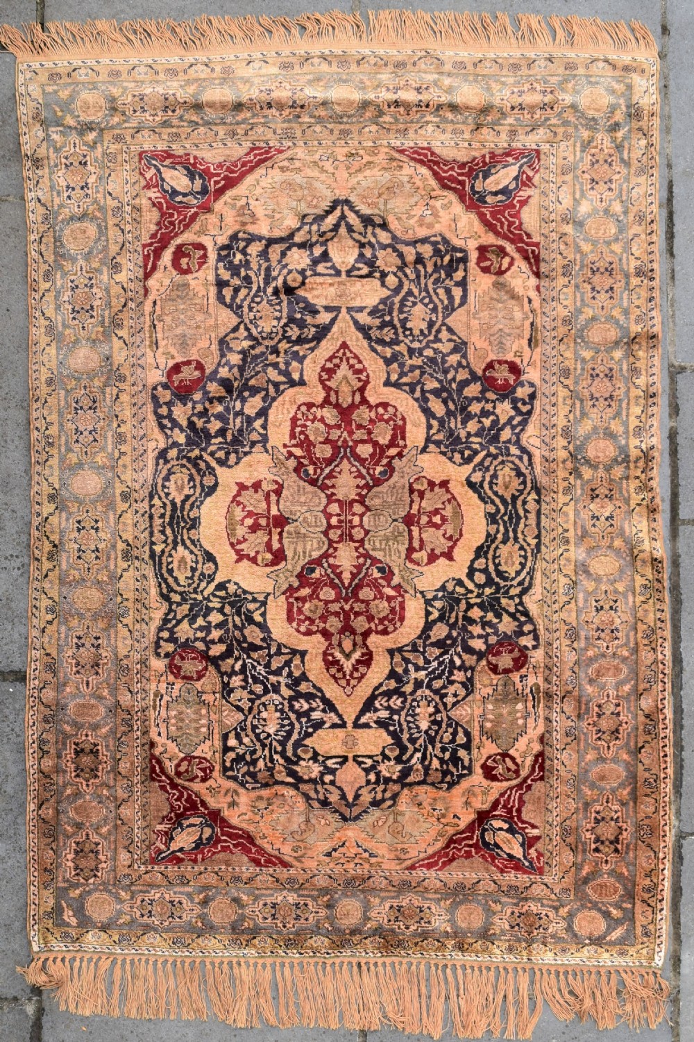 An antique hand-knotted Turkish Sivas rug featuring a central crimson medallion surrounded by navy spandrels and detailed floral borders in beige and blue tones.