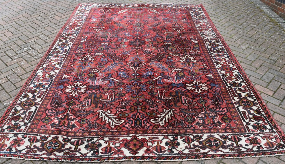 An Old Persian Heriz carpet with allover design 326x223cm
