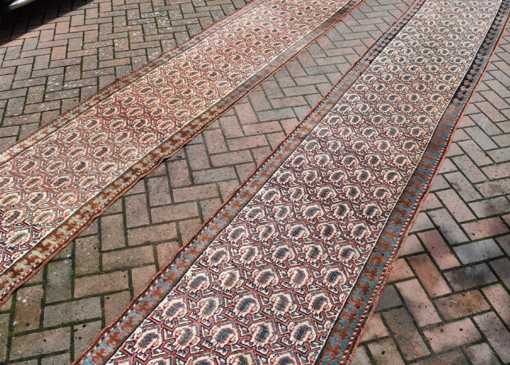 A pair of very long narrow antique runners View V