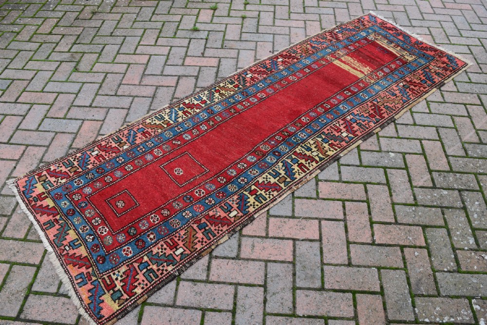 An antique North West Persian narrow runner 237x79cm View V