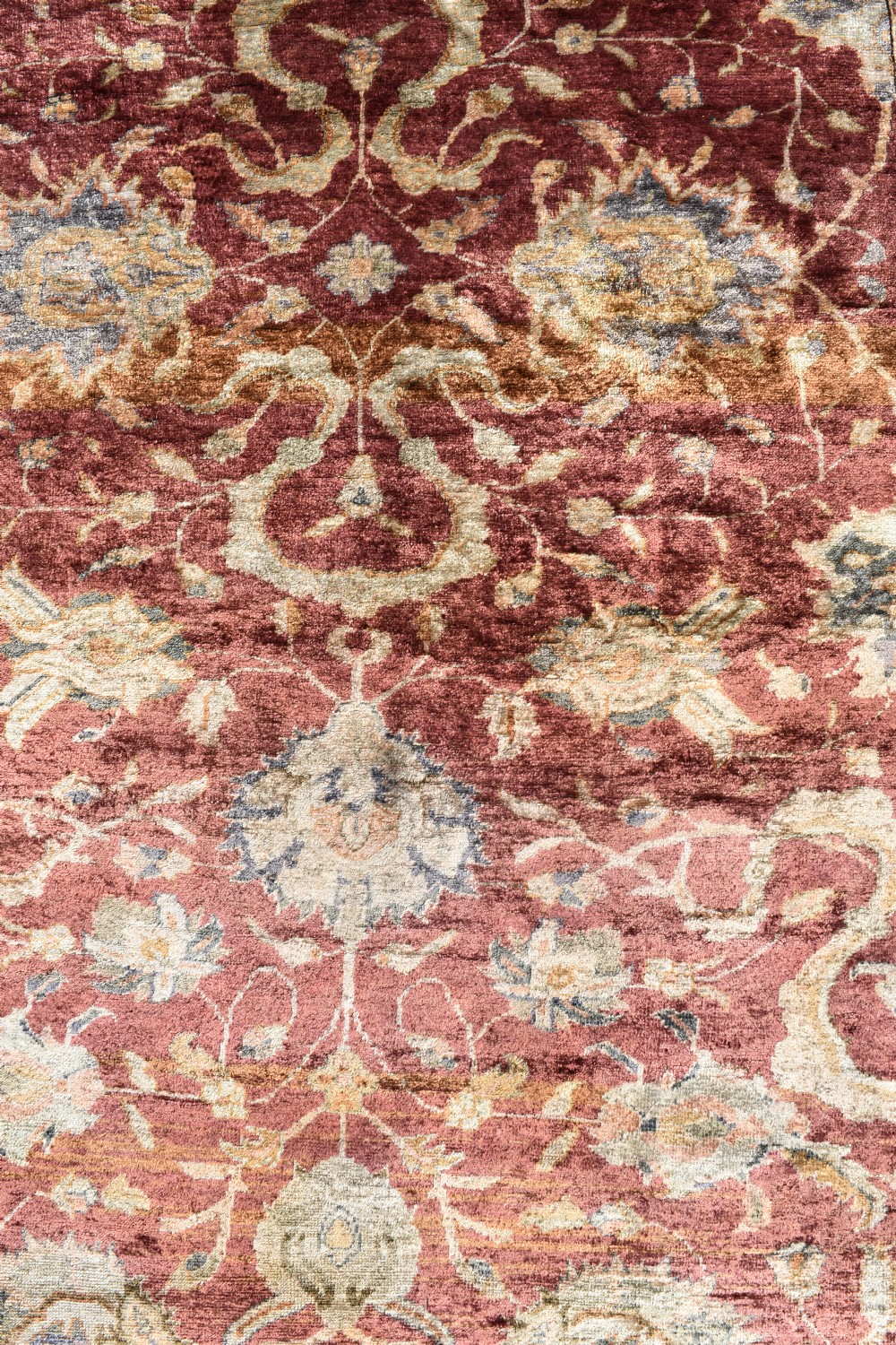 An antique rectangular Turkish Kayseri silk rug featuring an intricate floral central field in red and gold framed by a slate grey border with fringe along the ends. View III