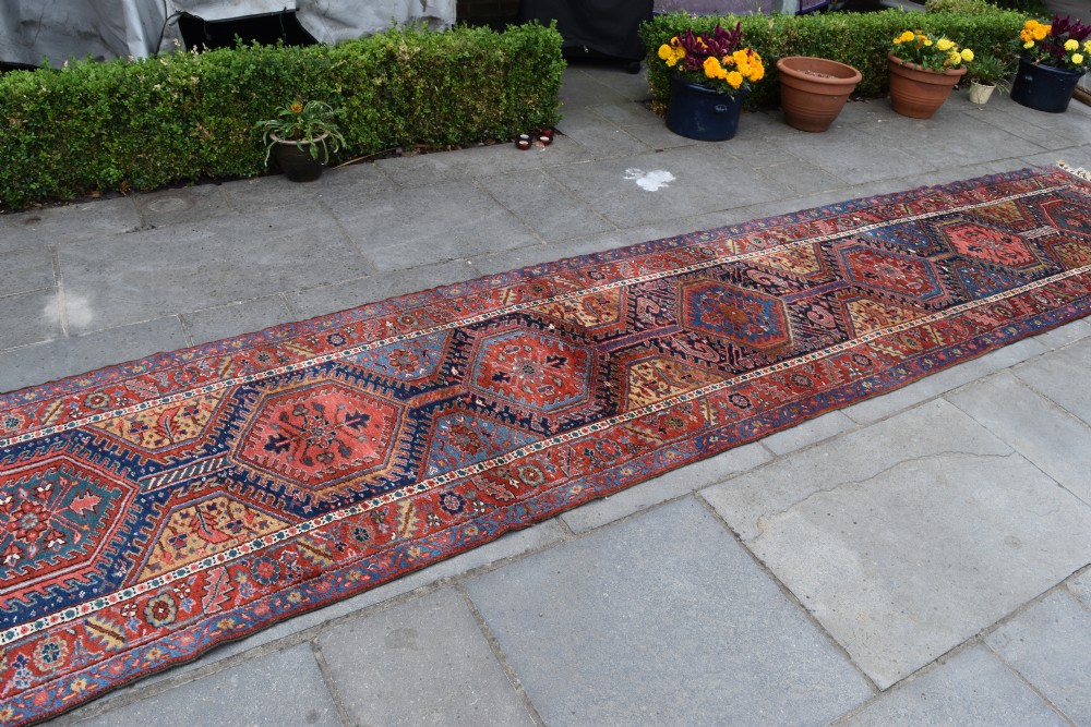 A large antique Heriz runner 530x105cm View V