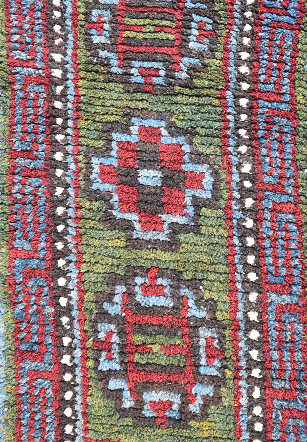 A rare green ground Tibetan monastic seating mat from the Wangden valley, Tibet View II