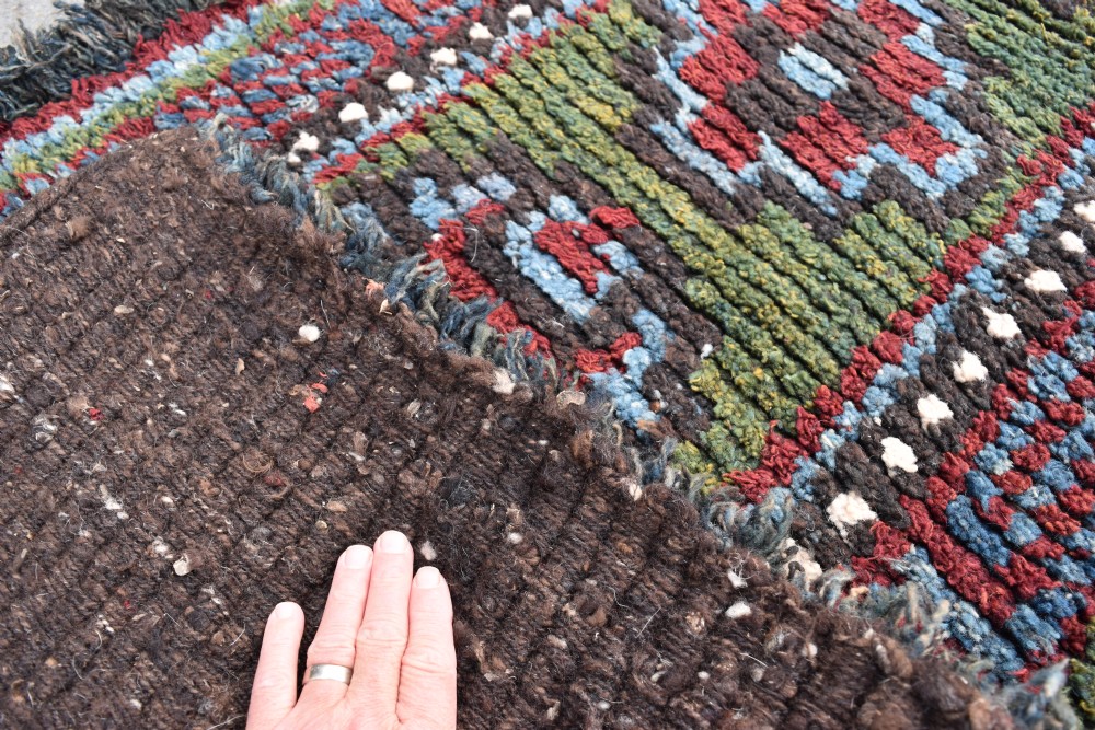 A rare green ground Tibetan monastic seating mat from the Wangden valley, Tibet View III